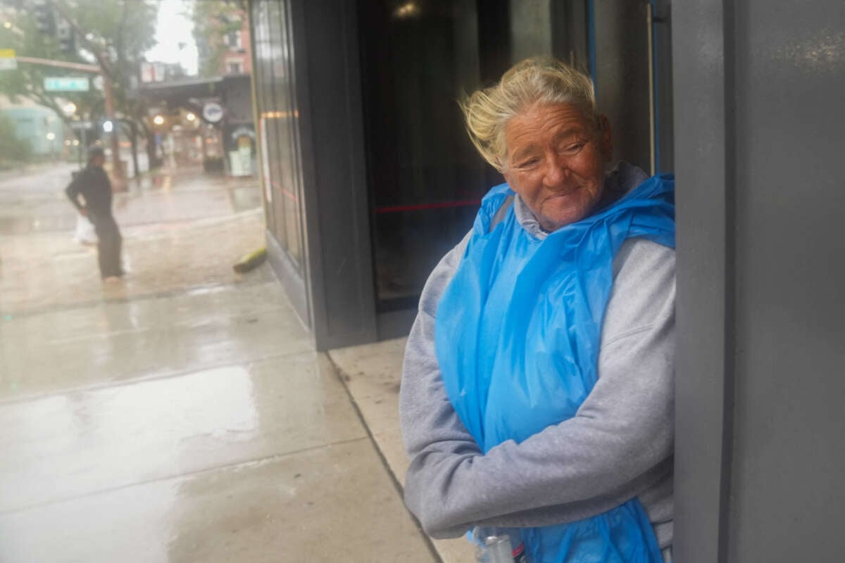 Pat Schaffer, who is unhoused, takes shelter at a building in St. Petersburg as Hurricane Milton is expected to make landfall later on October 9, 2024, in Florida.