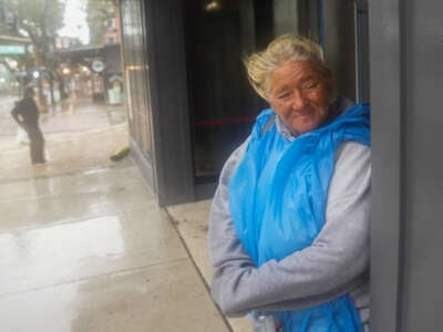 Pat Schaffer, who is unhoused, takes shelter at a building in St. Petersburg as Hurricane Milton is expected to make landfall later on October 9, 2024, in Florida.