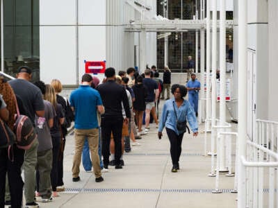 Voters head into a polling location to cast their ballots on the last day of early voting for the 2024 election on November 1, 2024, in Atlanta, Georgia.