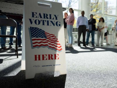 Residents line up to vote at the Stamford Government Center on the first day of early voting on October 21, 2024, in Stamford, Connecticut.