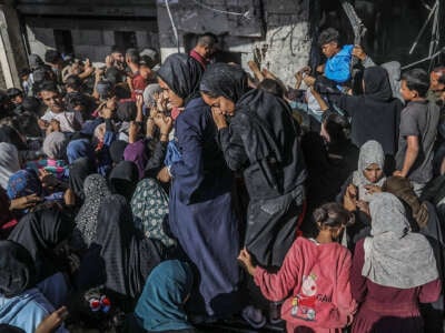 Displaced Palestinians line up for bread at the only bakery left in the city of Khan Younis on October 24, 2024.