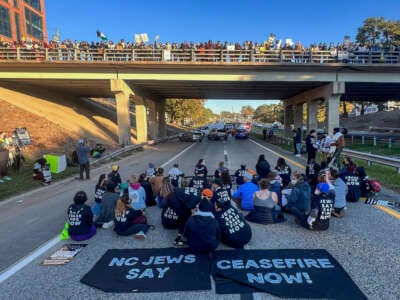 Demonstrators with Jewish Voice for Peace block the northbound lanes of the Durham Freeway at the South Magnum Street bridge for hours to demand a ceasefire in the war on Gaza, on November 2, 2023, in Durham, North Carolina.