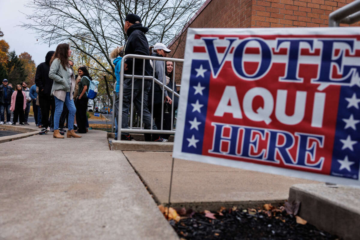 Voters line up outside of a polling station at Donegan Elementary School as the polls open on Election Day in Bethlehem, Pennsylvania, on November 5, 2024.