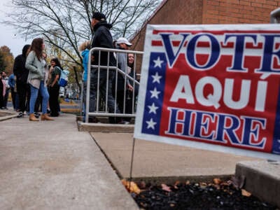 Voters line up outside of a polling station at Donegan Elementary School as the polls open on Election Day in Bethlehem, Pennsylvania, on November 5, 2024.