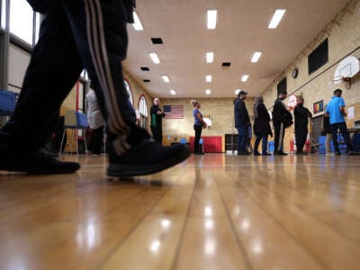 Voters wait in line to vote at the Lowrey School on November 5, 2024, in Dearborn, Michigan.