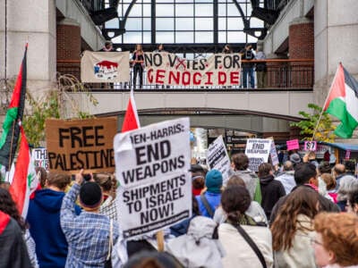 Pro-Palestinian demonstrators gather at Faneuil Hall Marketplace during a "No Votes for Genocide" rally organized by the Boston Coalition for Palestine ahead of the U.S. general election, in Boston, Massachusetts, on November 2, 2024.