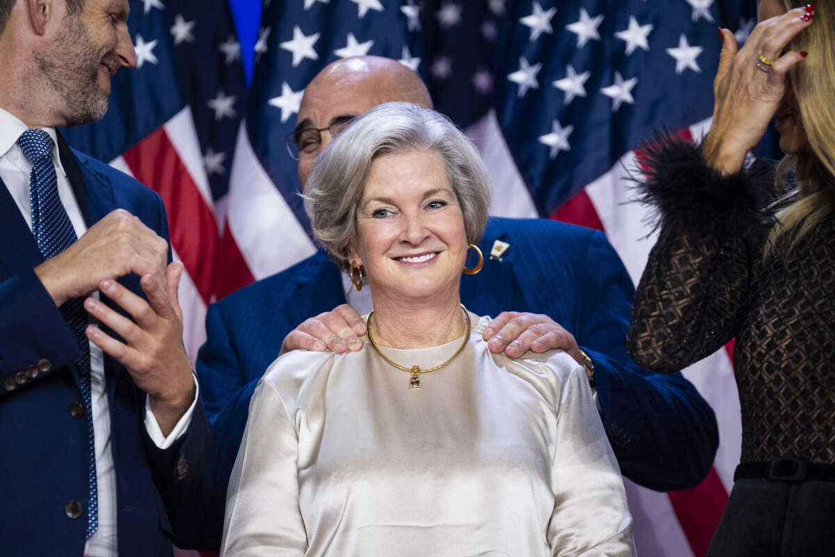 Chris LaCivita and Susie Wiles listen as former President Donald Trump speaks after being declared the winner of the 2024 presidential election during a watch party at the Palm Beach County Convention Center in West Palm Beach, Florida, in the early hours of November 6, 2024.