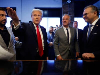 Former President Donald Trump visits The Great Commoner cafe with Robert F. Kennedy Jr. (center-right) on November 1, 2024, in Dearborn, Michigan.