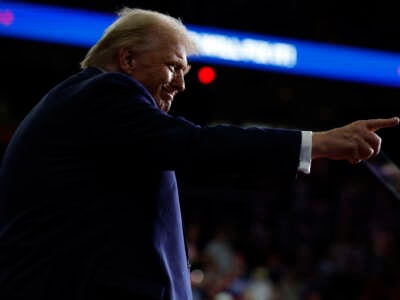 The new president-elect and former President Donald Trump walks off stage after his campaign rally at PPG Paints Arena on November 4, 2024, in Pittsburgh, Pennsylvania.