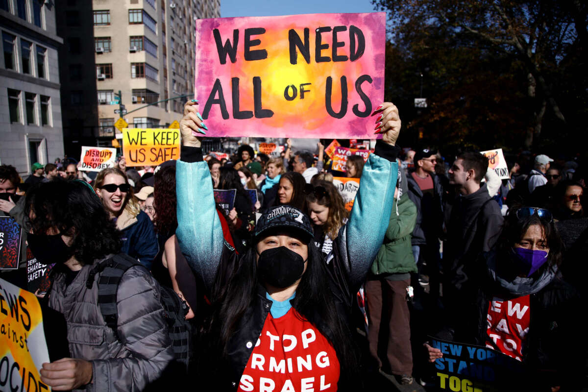 A detractor of president-elect Donald Trump protests against his policies in New York City on November 9, 2024.