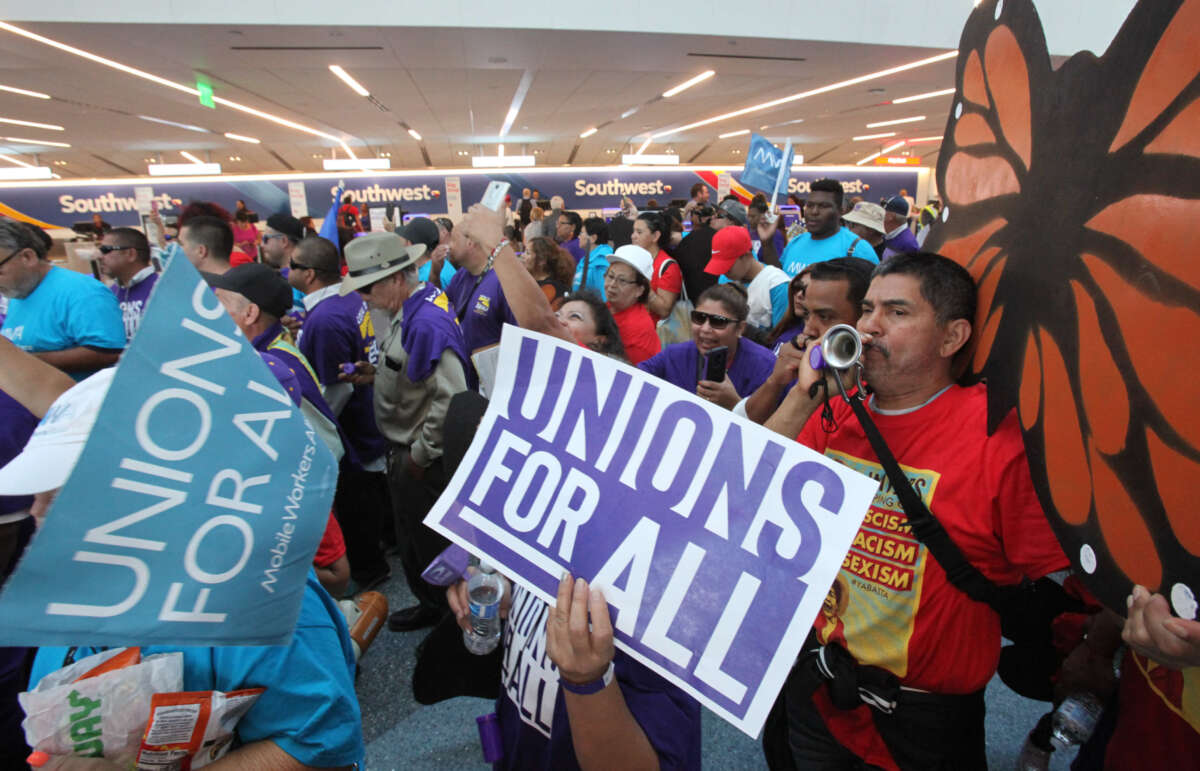 Pro-union demonstrators march through a section of Los Angeles International Airport on October 2, 2019, in Los Angeles, California.