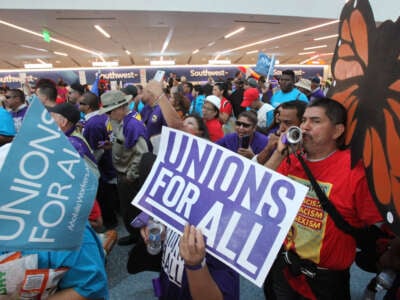 Pro-union demonstrators march through a section of Los Angeles International Airport on October 2, 2019, in Los Angeles, California.