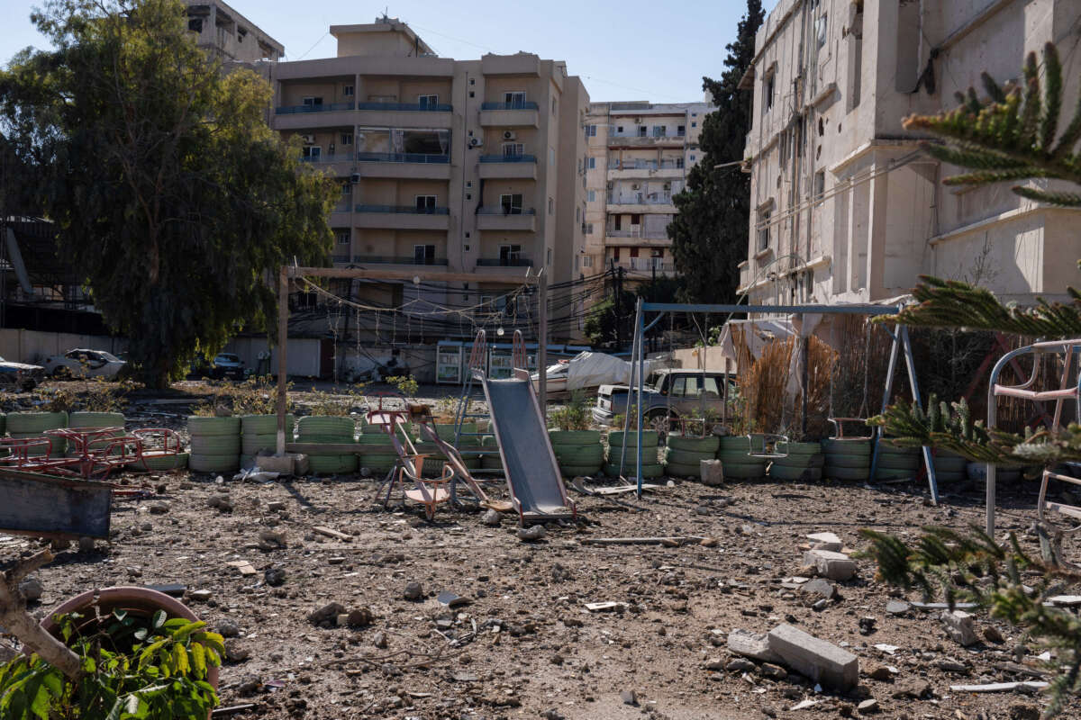 A children's playground stands covered in dust amid the destruction in central Tyre caused by an Israeli airstrike on the southern Lebanese port city.