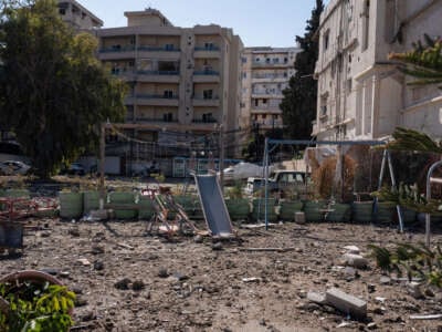 A children's playground stands covered in dust amid the destruction in central Tyre caused by an Israeli airstrike on the southern Lebanese port city.