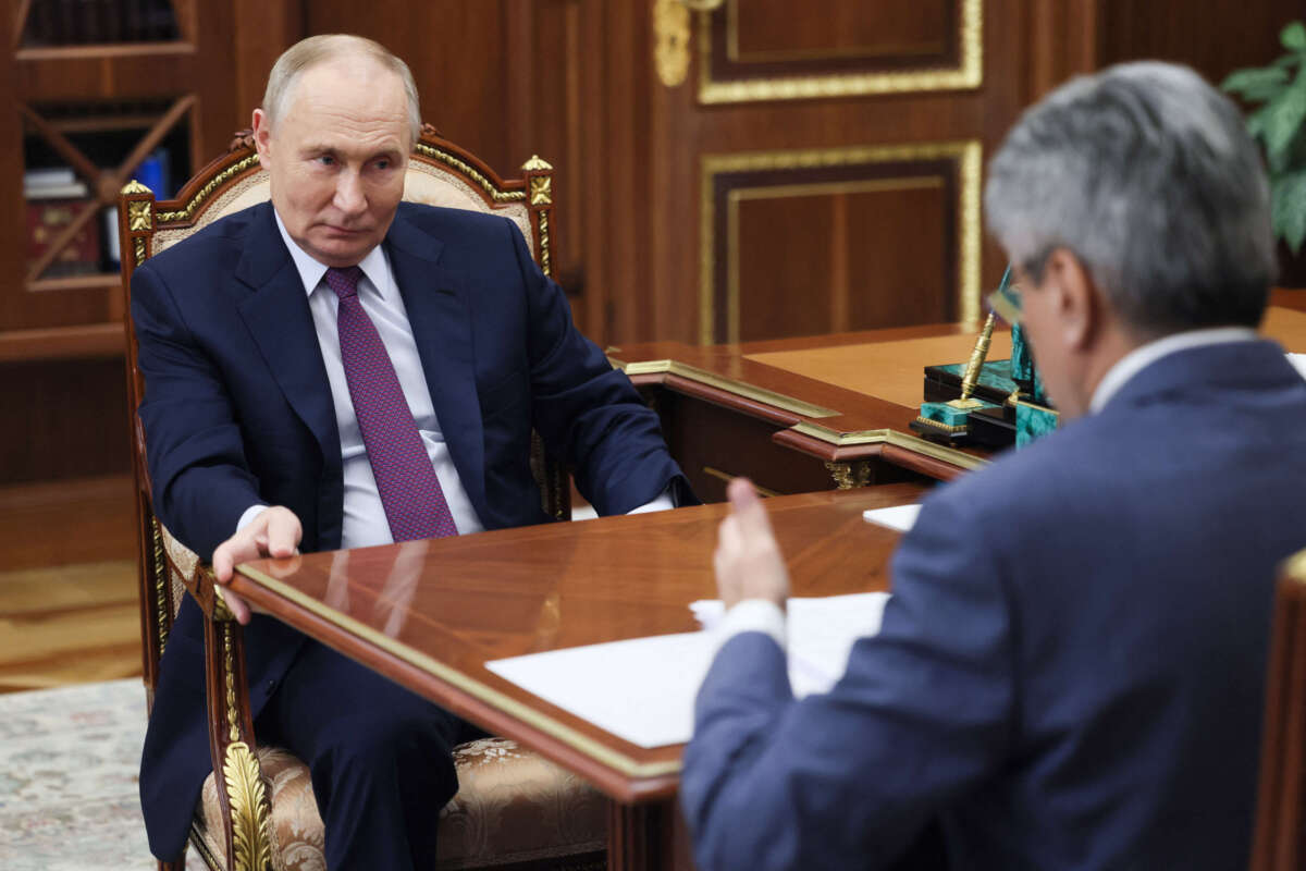 Russian President Vladimir Putin meets with the New People party's leader, Alexey Nechayev, at the Kremlin in Moscow, on November 19, 2024.