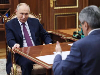 Russian President Vladimir Putin meets with the New People party's leader, Alexey Nechayev, at the Kremlin in Moscow, on November 19, 2024.