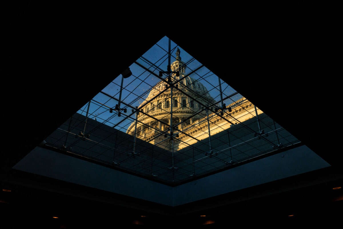 The U.S. Capitol Dome is seen through a window inside the Capitol Visitors Center at sunrise on Capitol Hill in Washington, D.C., on November 21, 2024.