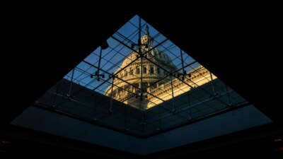 The U.S. Capitol Dome is seen through a window inside the Capitol Visitors Center at sunrise on Capitol Hill in Washington, D.C., on November 21, 2024.