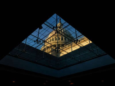 The U.S. Capitol Dome is seen through a window inside the Capitol Visitors Center at sunrise on Capitol Hill in Washington, D.C., on November 21, 2024.