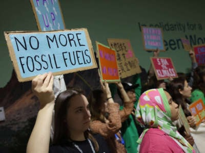 Activists protest against fossil fuels and for climate finance at the COP29 climate summit in Baku, Azerbaijan, on November 22, 2024.