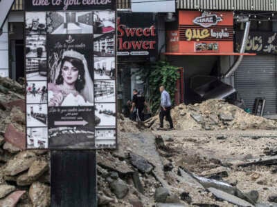 Palestinians walk in the middle of the destroyed commercial market in the city of Jenin in the West Bank, which was demolished by the bulldozers of the Israeli occupation forces, on November 20, 2024.