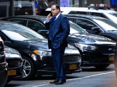 Boris Epshteyn, an aide to former President Donald Trump, speaks on the phone during a visit the FDNY Engine 2, Battalion 8 firehouse on May 2, 2024, in New York City.