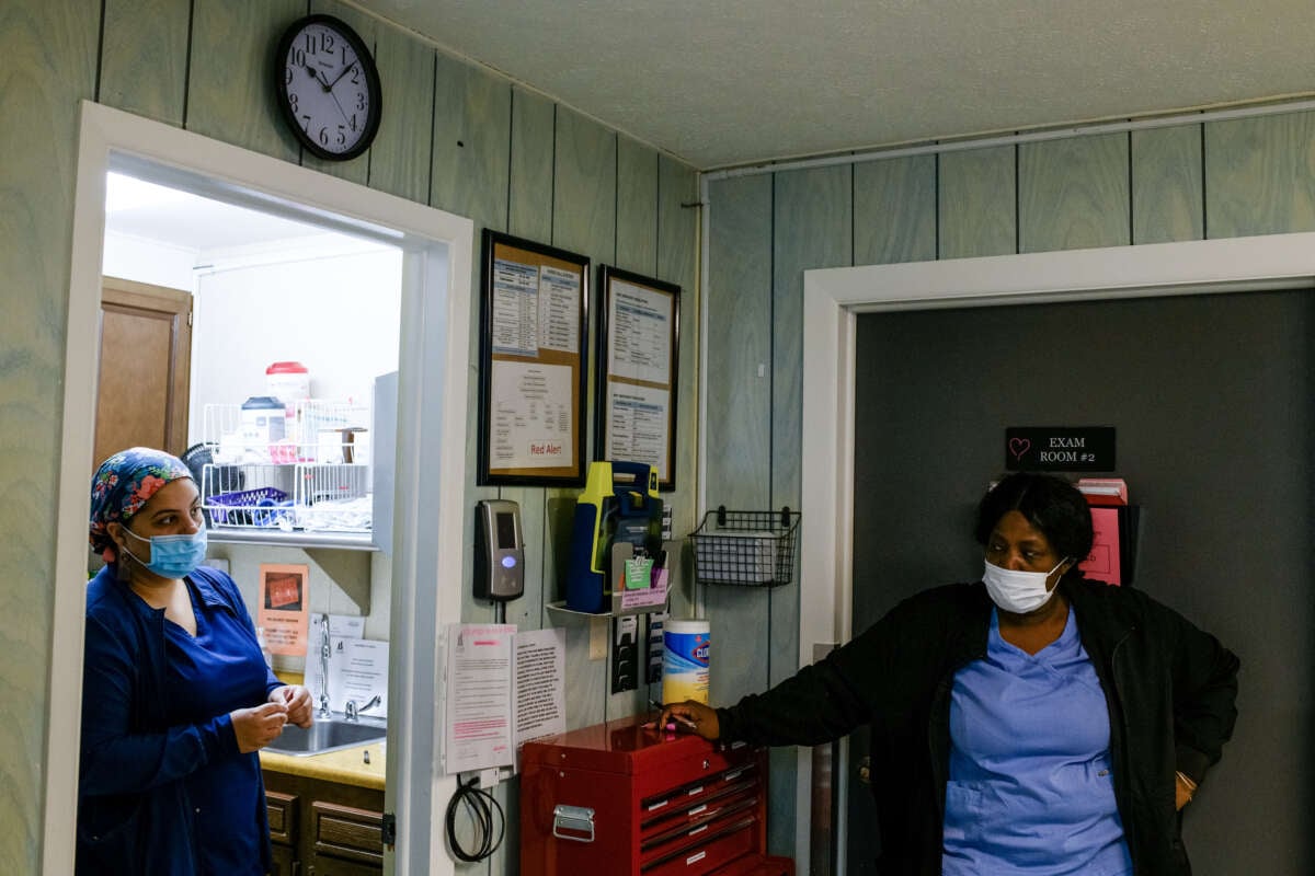 A nurse and a medical assistant wait for the completion of an abortion procedure at the Scotsdale Womens Center in Detroit, Michigan, on May 5, 2022.