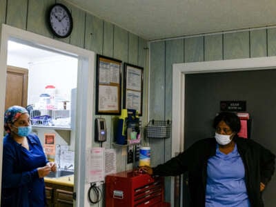 A nurse and a medical assistant wait for the completion of an abortion procedure at the Scotsdale Womens Center in Detroit, Michigan, on May 5, 2022.