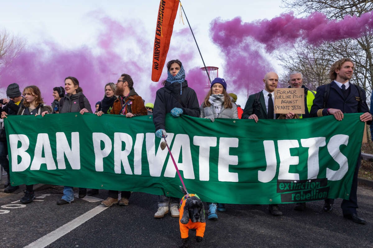 Climate activists including Greta Thunberg march to protest against private jet flights and the proposed expansion of Farnborough Airport on January 27, 2024, in Farnborough, United Kingdom.