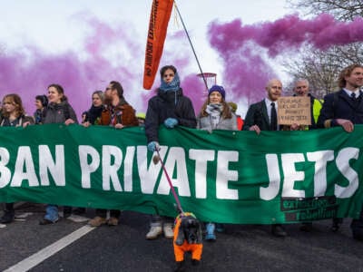 Climate activists including Greta Thunberg march to protest against private jet flights and the proposed expansion of Farnborough Airport on January 27, 2024, in Farnborough, United Kingdom.