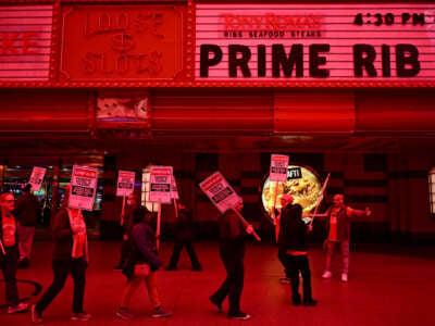 Supporters of the Culinary Workers and Bartenders Unions carry picket signs calling for a fair contract ahead of a strike deadline outside of the Fremont Hotel & Casino in downtown Las Vegas, Nevada, on February 2, 2024.