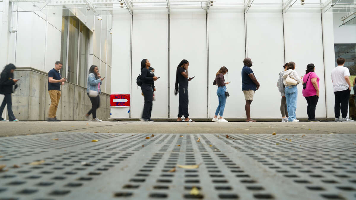 Voters head into a polling location to cast their ballots on the last day of early voting for the 2024 election on November 1, 2024, in Atlanta, Georgia.