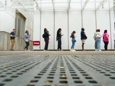 Voters head into a polling location to cast their ballots on the last day of early voting for the 2024 election on November 1, 2024, in Atlanta, Georgia.