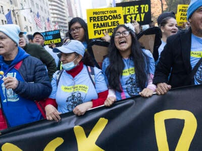 Immigrant rights supporters join an anti-Trump protest march in anticipation of the newly elected president's immigration policies on November 9, 2024, in midtown New York City.