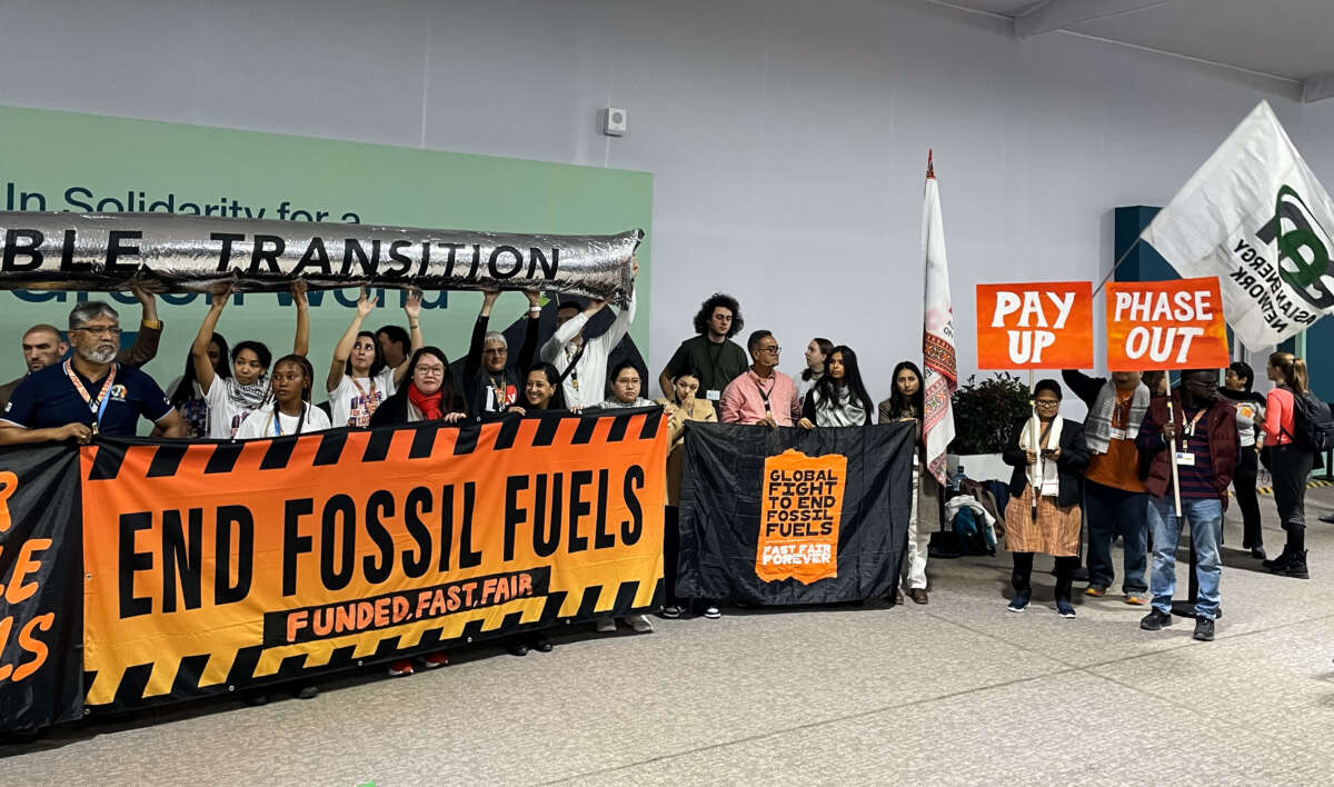 Climate activists stage a protest to demand a phase-out of fossil fuels during the United Nations Climate Change Conference (COP29) in Baku, Azerbaijan, on November 15, 2024.