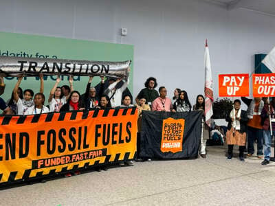 Climate activists stage a protest to demand a phase-out of fossil fuels during the United Nations Climate Change Conference (COP29) in Baku, Azerbaijan, on November 15, 2024.