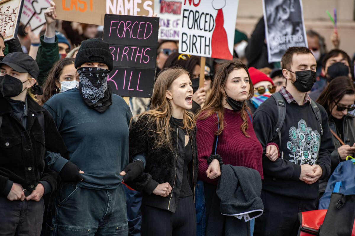 Counter protesters try to block the National Men's March to abolish abortion and rally for personhood in Boston, Massachusetts, on November 16, 2024.