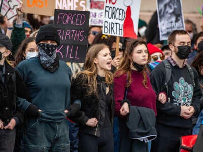 Counter protesters try to block the National Men's March to abolish abortion and rally for personhood in Boston, Massachusetts, on November 16, 2024.