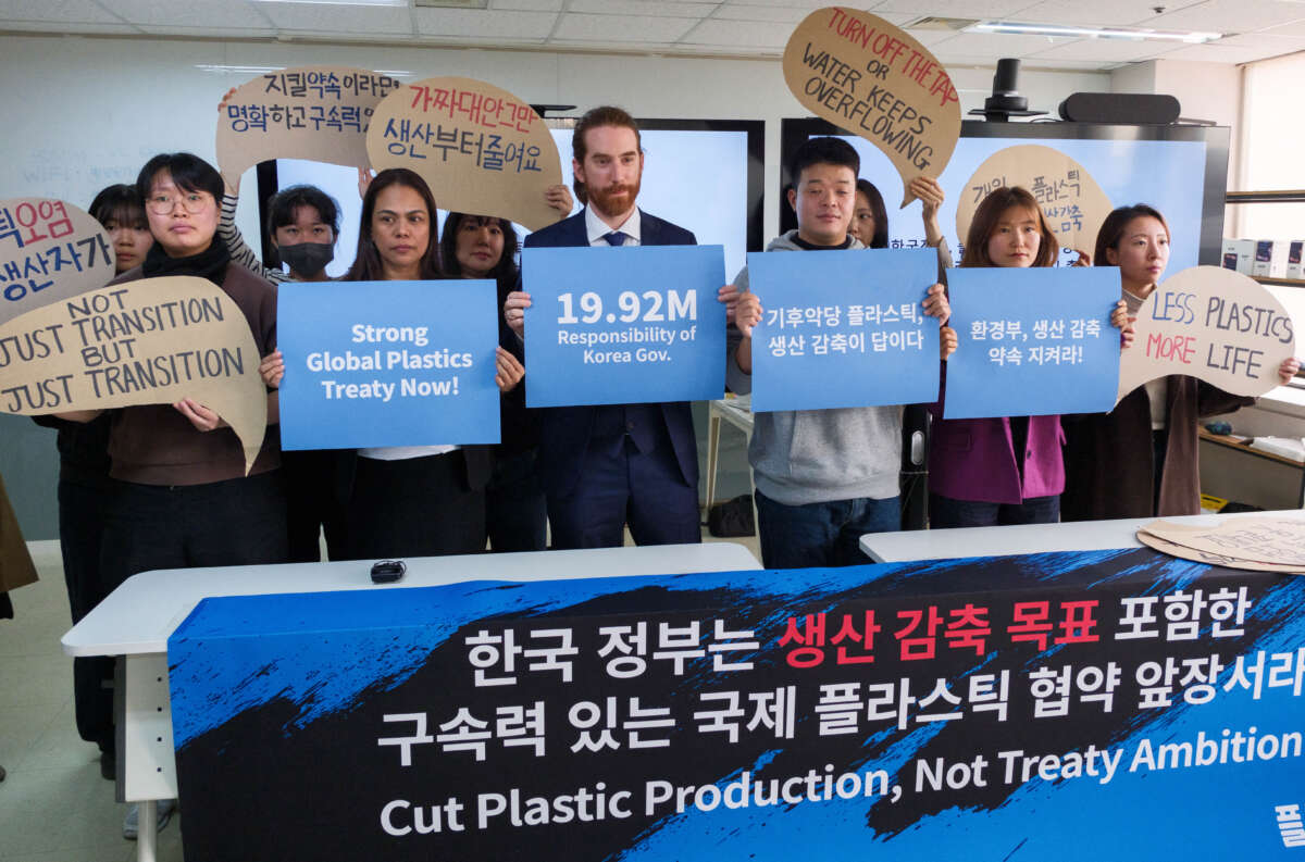 Greenpeace activists display banners in Seoul, South Korea, on November 19, 2024, ahead of the fifth session of the Intergovernmental Negotiating Committee (INC-5) to develop an international legally binding instrument on plastic pollution.