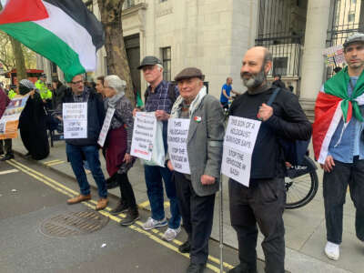 Haim Bresheeth, center, at a national demonstration in London, U.K., in March 2024, with a group of Holocaust survivors and survivor descendants against the Gaza genocide.