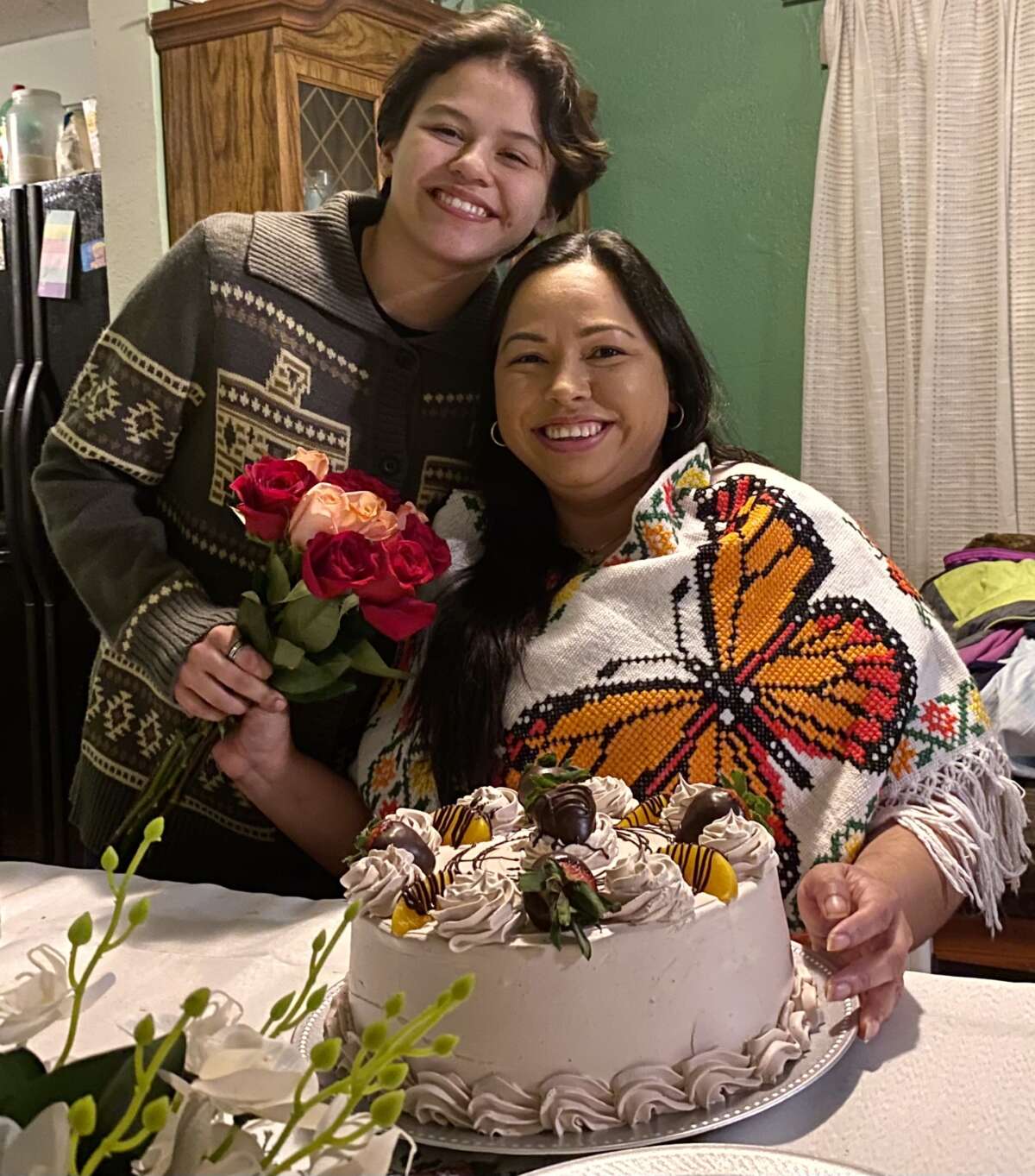 Sandra Avalos and her son celebrate together at home.