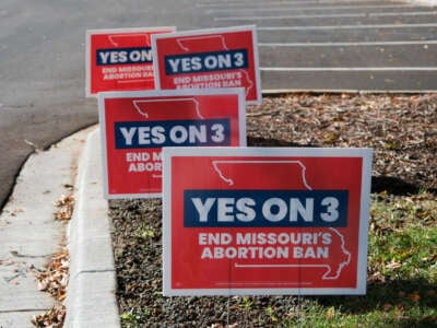 Signs in support of Missouri's abortion ballot measure