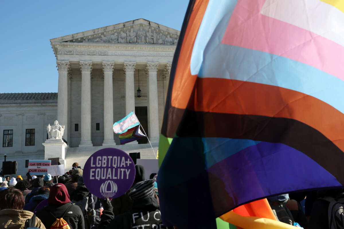 Transgender rights supporters and opponents rally outside of the U.S. Supreme Court as the high court hears arguments in a case on transgender health rights on December 4, 2024, in Washington, D.C.