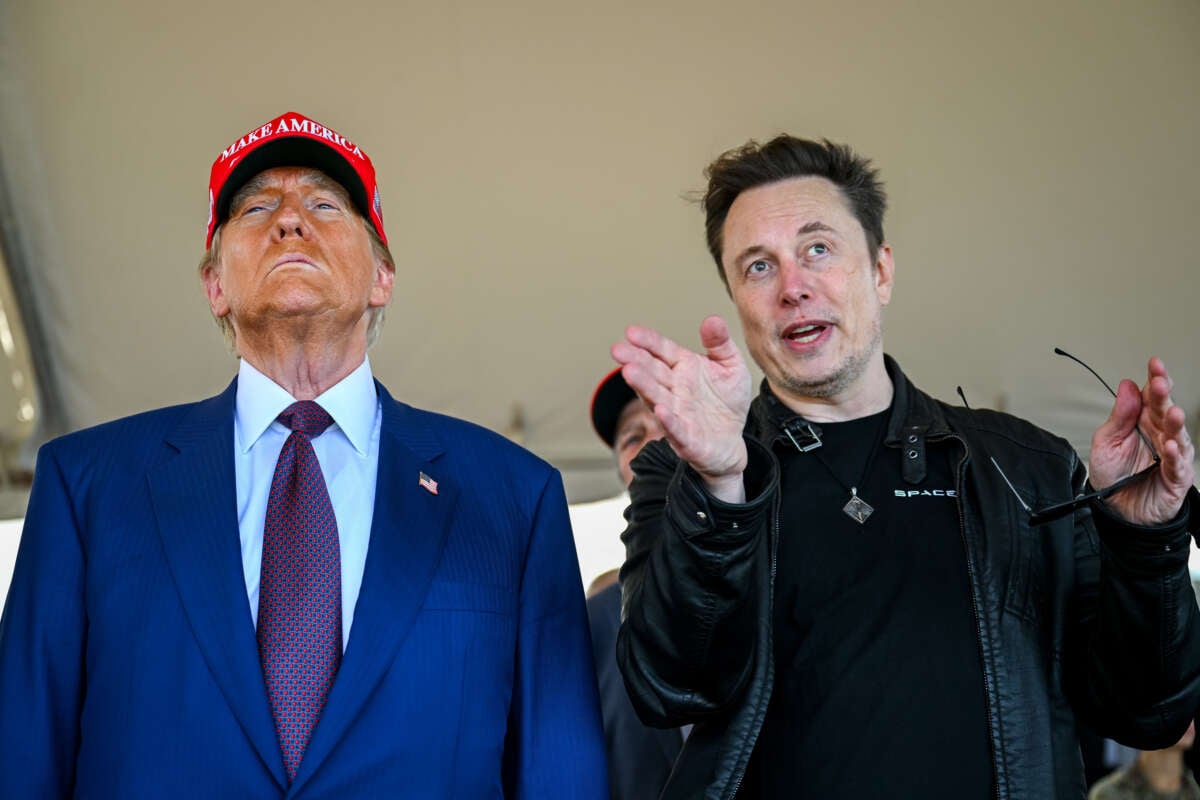 Elon Musk speaks with President-elect Donald Trump as they watch the launch of the sixth test flight of the SpaceX Starship rocket on November 19, 2024, in Brownsville, Texas.