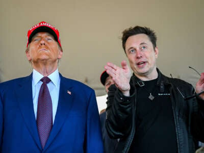 Elon Musk speaks with President-elect Donald Trump as they watch the launch of the sixth test flight of the SpaceX Starship rocket on November 19, 2024, in Brownsville, Texas.