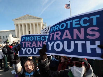 Supporters of trans rights and their opponents rally outside of the U.S. Supreme Court as the high court hears arguments in a case on trans health care bans, on December 4, 2024, in Washington, D.C.