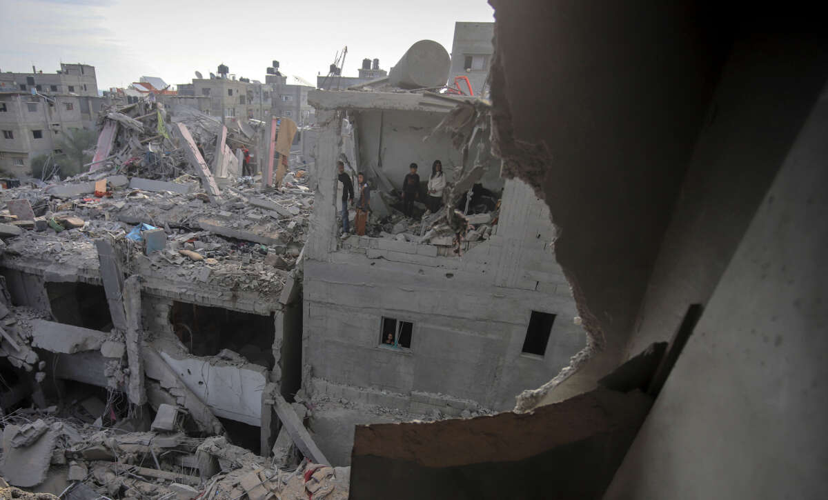 A wide view captures the destruction of residential buildings in the Nuseirat refugee camp, central Gaza Strip, on December 7, 2024.