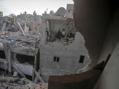 A wide view captures the destruction of residential buildings in the Nuseirat refugee camp, central Gaza Strip, on December 7, 2024.