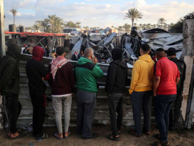 Palestinians inspect the damage in the aftermath of an Israeli strike on a tent camp in Khan Younis, Gaza Strip, on December 5, 2024, amid the ongoing war between Israel and Hamas militants.