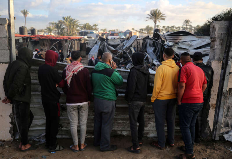 Palestinians inspect the damage in the aftermath of an Israeli strike on a tent camp in Khan Younis, Gaza Strip, on December 5, 2024, amid the ongoing war between Israel and Hamas militants.